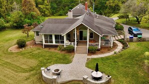 A two-story house with a covered patio, a fire pit, and a driveway. - Mtn Views, Deck, Porches & Patio: Asheville Escape (Asheville)