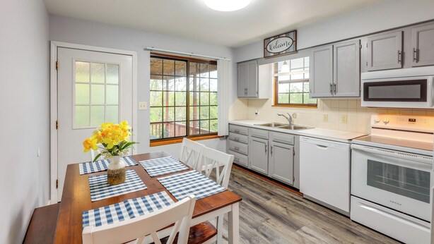 A kitchen with white cabinets, a built-in oven, and a microwave. - Kentucky Countryside Escape: 5 Mi to Williamstown! (Williamstown)