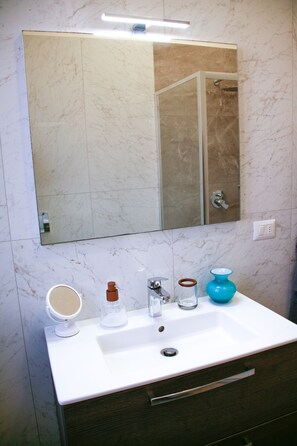 Bidet, towels, soap, toilet paper