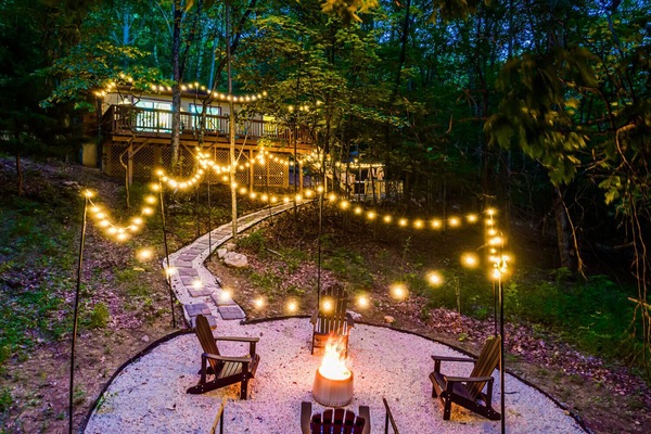 Beautifully illuminated walkways and a cozy firepit