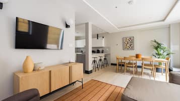 Apartment, 3 Bedrooms, Patio | Living area | 44-inch Smart TV with cable channels