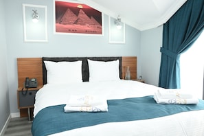 Deluxe Double Room, Balcony, City View | In-room safe, desk, soundproofing, iron/ironing board