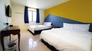 A hotel room with two beds, a TV, a small table, and a window with curtains. - The Colony By Cactus Hotel Johor Jaya (Johor Bahru)