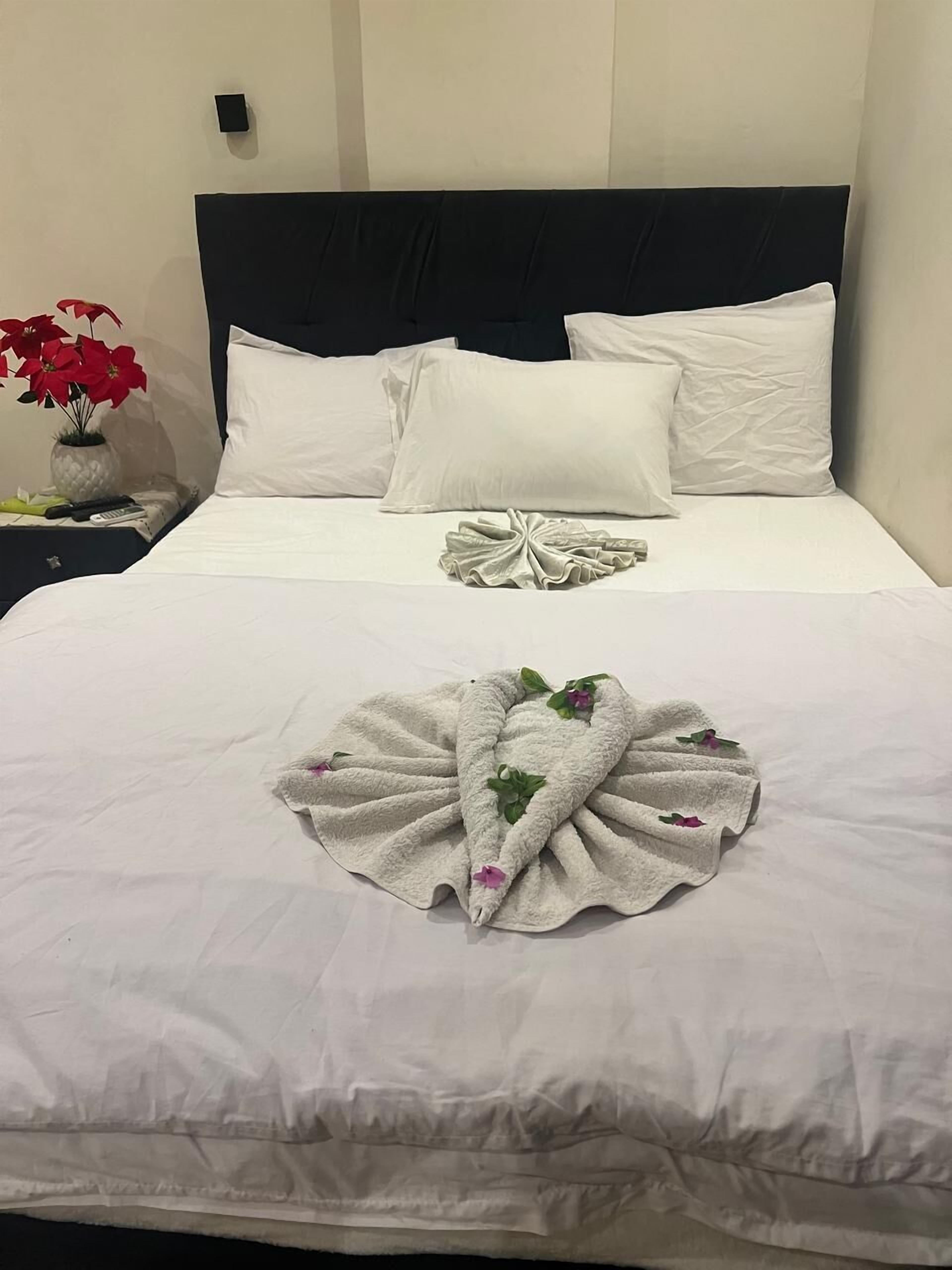 Premium bedding, pillow-top beds, in-room safe, laptop workspace