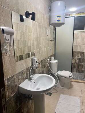 Deluxe Quadruple Room, Garden View | Bathroom | Shower, hair dryer, towels, soap