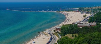 Historic Beach Cottage Steps away from The Deck and across from the beach