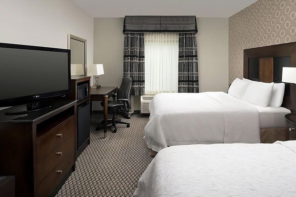 Relax in a bright room with sofa and workspace comfort.