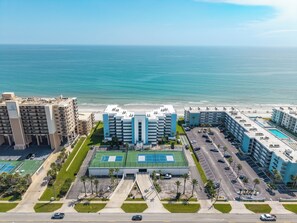 A multi-story hotel with a rooftop pool, adjacent to a beach. - ☀️ Oceanfront with Incredible Amenities-Sunrise 206 ☀️ (New Smyrna Beach)