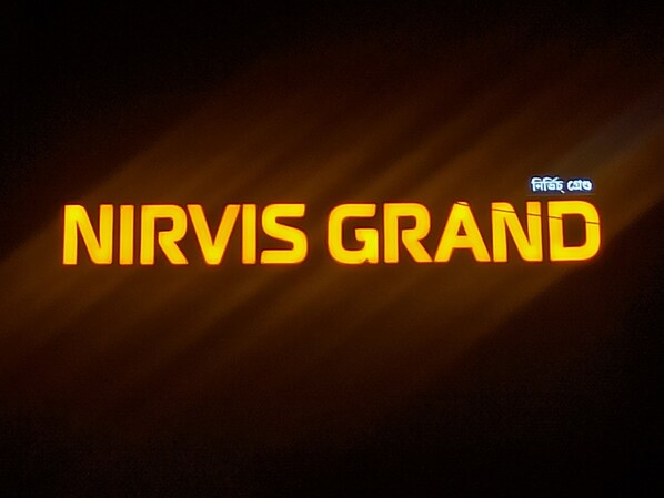 The text "NIRVIS GRAND" in bold, yellow letters against a dark background with a gradient effect. - Nirvis Grand (Guwahati)