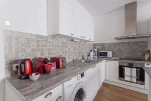 Appartement, patio, vue ville | Cuisine privée