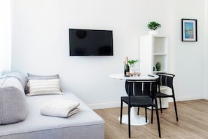 Deluxe Studio, Partial Lake View | Blackout drapes, iron/ironing board, free WiFi