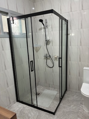 Shower, hair dryer, towels, soap