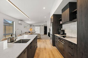 Fridge, microwave, coffee/tea maker, cookware/dishes/utensils