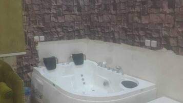 Economy Apartment, 1 Bedroom | Bathroom | Slippers, towels