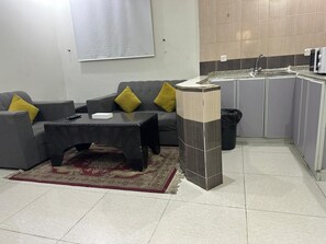 Family Apartment, 2 Bedrooms | Living area | 42-inch LED TV with satellite channels