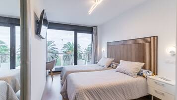 2 quartos, ferros/tábuas de passar roupa, roupa de cama