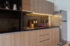 Fridge, microwave, stovetop, coffee/tea maker