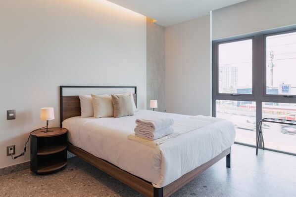 1 bedroom, desk, iron/ironing board, travel crib