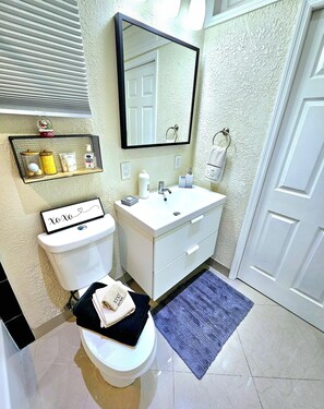 Hair dryer, towels, soap, shampoo