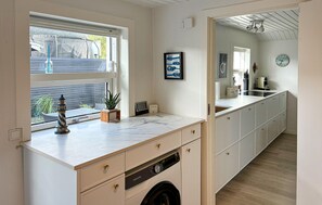 Fridge, stovetop, dishwasher, coffee/tea maker