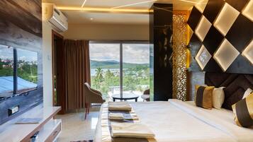 Habitación individual Deluxe, 1 cama de matrimonio grande, Aire acondicionado | Escritorio, espacio para trabajar con un portátil, cortinas opacas