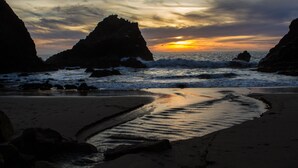 A beach with rocky formations and a sunset. - Beautiful Large Home w Game Room on Private Acreage  (Gualala)