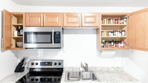 Fridge, microwave, stovetop, coffee/tea maker