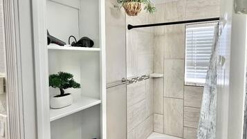 Shower, hair dryer, towels, soap