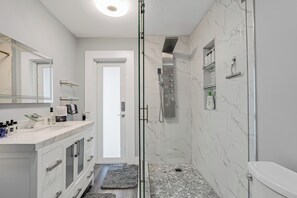 Shower, hair dryer, towels, soap