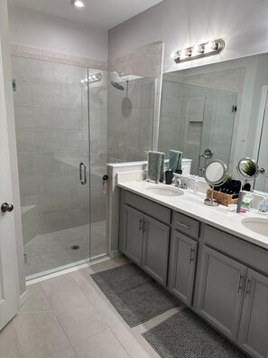 Shower, hair dryer, towels, soap