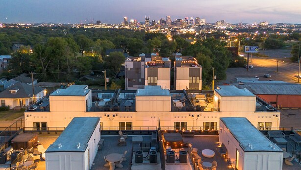 A rooftop terrace with outdoor seating and a city view. - Fall in Nashville: hot tub, skyline views, sleeps 12 near Broadway (Nashville)