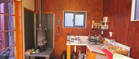 Stovetop, coffee/tea maker, cookware/dishes/utensils, paper towels