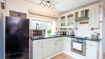 Fridge, microwave, oven, cookware/dishes/utensils