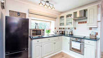 Fridge, microwave, oven, cookware/dishes/utensils