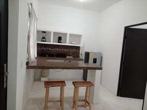 Fridge, coffee/tea maker, cookware/dishes/utensils, kitchen islands