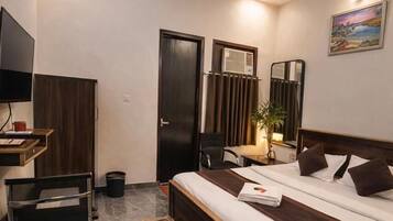 Chambre Deluxe, vue ville | Bureau, fer et planche à repasser, Wi-Fi gratuit