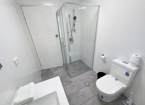 Shower, hair dryer, towels, toilet paper