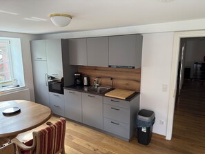 Fridge, microwave, stovetop, coffee/tea maker