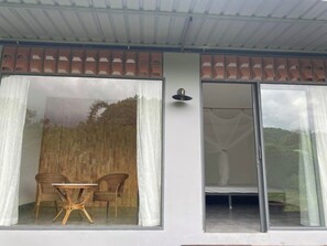 Terrace/patio - Hannah Garden is the house at the foot of the hill by the stream, pet friendly. (Buôn Ma Thuột)