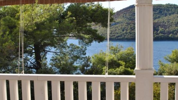 A white wooden deck with a view of a lake and hills. - Apartments Maritimo - Comfort Two Bedroom Apartment with Sea View and Terrace (Smokvica)