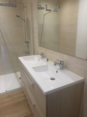 Shower, hair dryer, towels, soap