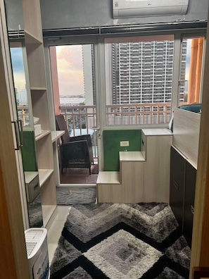 Comfort Condo, 1 Bedroom, Balcony, Poolside | Individually decorated, individually furnished, laptop workspace - Breeze Residences Condos (Pasay)