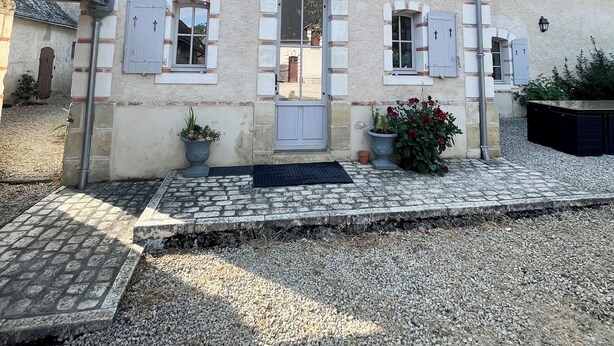 A two-story building with a symmetrical facade, a central entrance with a door, and a small balcony above the door. - The maples - sainte maure de Touraine (Sainte-Maure-de-Touraine)
