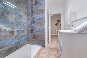 Shower, towels, toilet paper