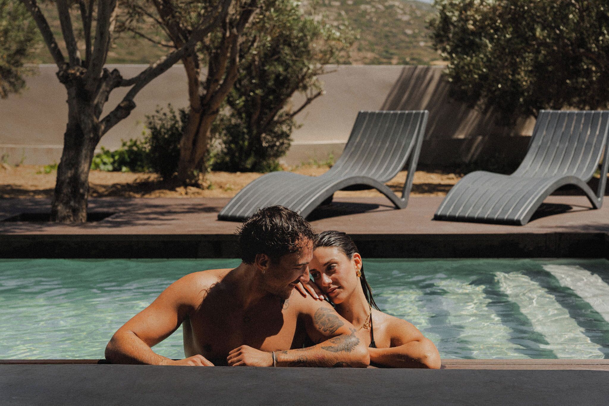 Seasonal outdoor pool, pool loungers