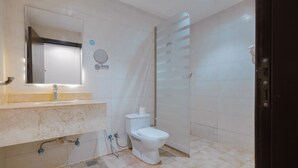 A modern bathroom with a toilet, sink, and shower. - Akarem Jazan Serviced Apartments (Jizan)