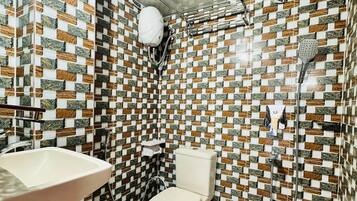 Shower, free toiletries, slippers, towels