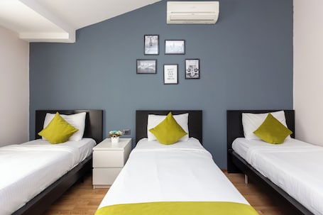 Triple Room, City View | Soundproofing, iron/ironing board, free WiFi