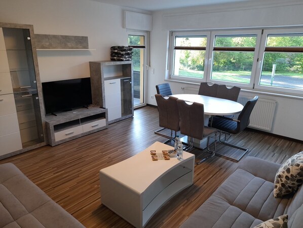 Deluxe Condo, Balcony, Garden View | Living area | 55-inch Smart TV with satellite channels