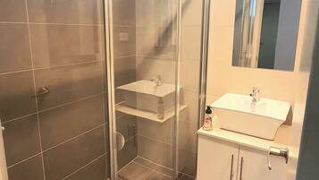 Shower, towels, soap, toilet paper